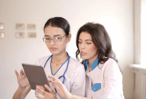 Two doctors with tablet computer Stock Photos