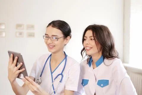 Two doctors with tablet computer Stock Photos