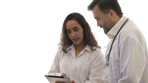 Two doctors talking and discussing with digital tablet in hospital Stock Footage 278359875