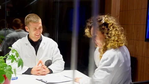 Two doctors talking in a meeting room Stock Footage 260426191