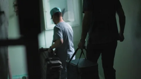 Two doctors walk down the stairs Stock Footage 101011597