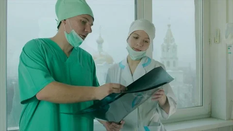 Two doctors watching X-Ray pictures Video stock 75244608