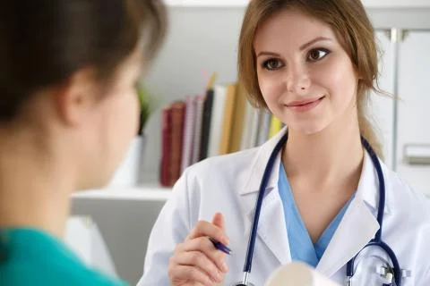 Two doctors working at their office Stock Photos