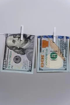 Two Dollar Bills Hanging Upside Down on Clothesline For Money Laundering Stock-Fotos