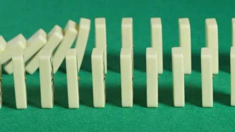 Two domino lines falling in slow motion Stockbeeldmateriaal 161035809