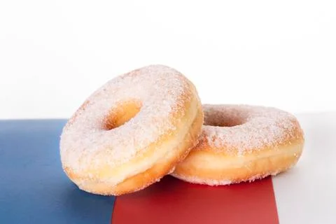 Two Donuts on a blue, red, white Background, Isolated Foto stock