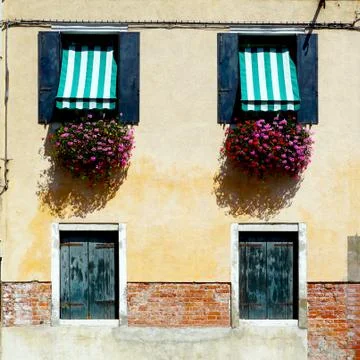 Two doors and two windows house building Stock Photos