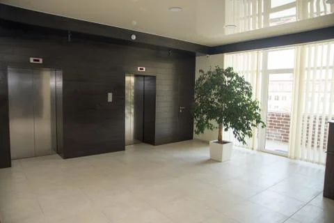 Two doors of elevators in modern business building. Stock Photos
