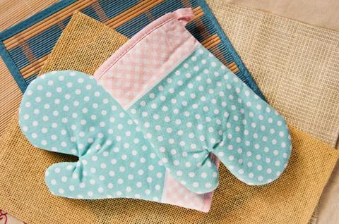 Two dotted kitchen oven gloves Stock Photos