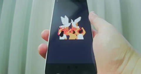 Two dover over fire flames, people watching and filming on smartphone Video stock 313502768
