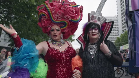 Two drag performers in elaborate sequined costumes and decorative headdresses Stock Footage 346238597