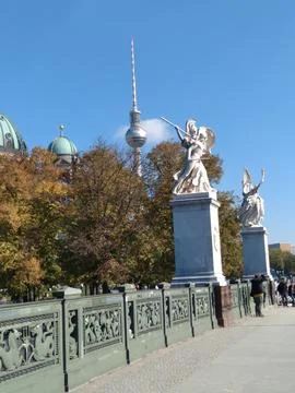 Two dramatic white statues of armored men with wings in combat Stock Photos