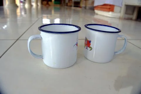 Two drinking cups are lined up on the floor Stock Photos