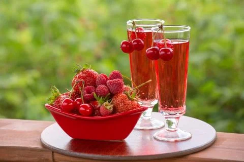Two drinks, red drink, cherry, strawberry, raspberry Stock Photos