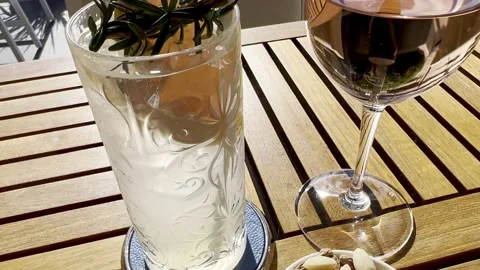 Two drinks sitting on a bar table in a restaurant at Crown hotel Stock Footage 166889085