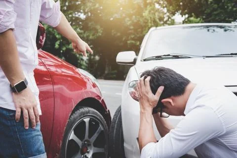Two drivers man arguing after a car traffic accident collision, Traffic Accid Stock Photos