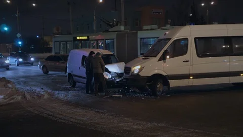 Two drivers talking near their wrecked cars after the car accident 4K slow mo Stock Footage 101261894