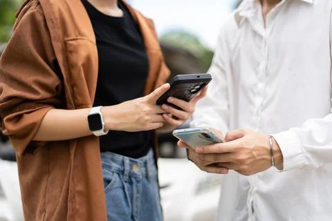 Two Drivers using a smartphone to exchange phone numbers and social media a.. Stock Photos