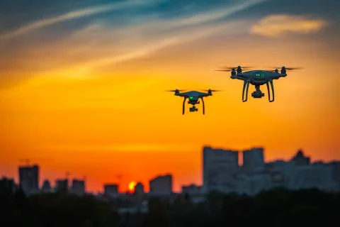 Two drone quad copters with high resolution digital camera flying Fotos Stock