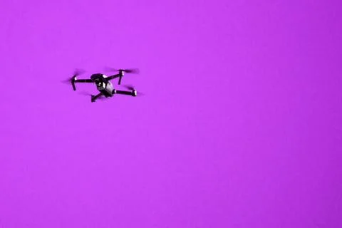 Two drone quad copters with high resolution digital camera flying aerial over Stock Photos