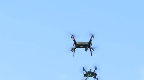 Two drones hovering on sky background. Modern technology in operation Video stock 62652297