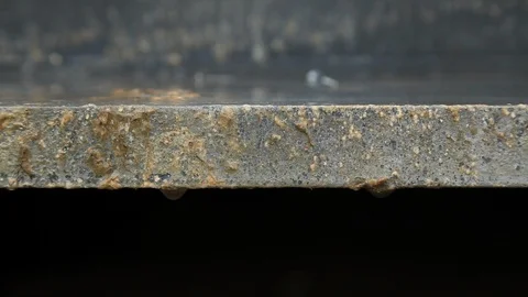 Two Drops Falling down from a Steel Girder Stock Footage 95838974