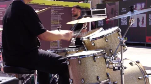 Two drummers playing music synchronized in Muse-X Stock Footage 313751826