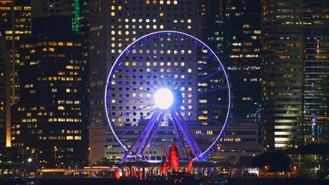 Two Duckling Tour boats in front of Ferris Wheel Hong Kong Stock Footage 124996363
