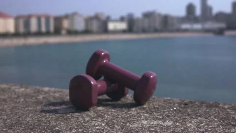 Two dumbbells lie nga open bloat Stock Footage 206366798
