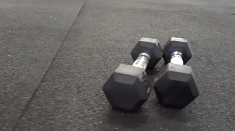 Two dumbbells side-by-side Stock Footage 54372315