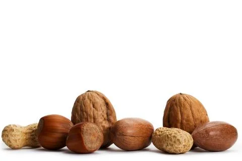 Two of each pecan hazelnuts walnuts and peanuts Stock Photos