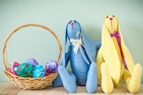 Two easter bunnies on a wooden table Stock Photos