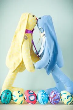 Two easter bunnies on a wooden table Stock Photos