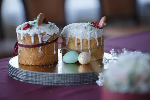 Two Easter cakes and colored eggs Stock Photos