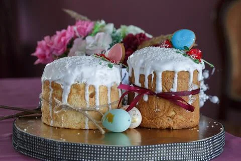 Two Easter cakes and colored eggs Stock Photos