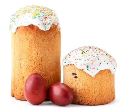 Two easter Easter cakes and colored eggs on a white. Easter composition Stock Photos