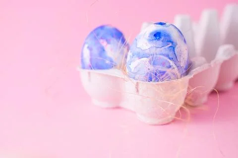 Two easter eggs decorated with classic blue watercolour aquarelle in carton 스톡 사진