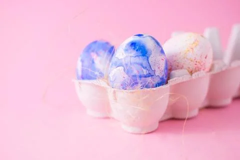 Two easter eggs decorated with classic blue watercolour aquarelle in carton Stock Photos