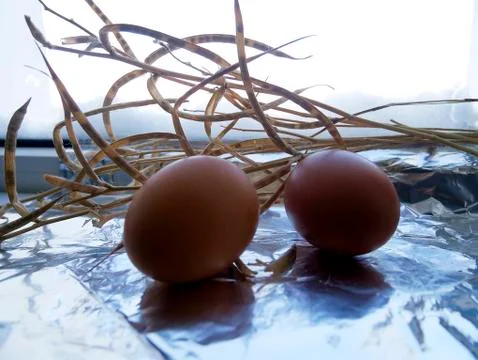Two easter eggs , lighting a counter Stock Photos