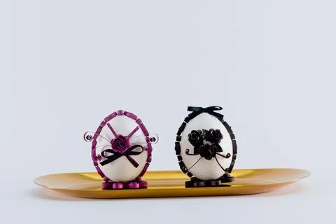 Two Easter eggs on a yellow tray Stock Photos