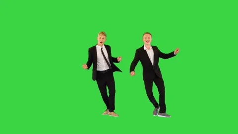 Two easygoing office workers make a funny greeting and start an old school dance Stock Footage 219463180