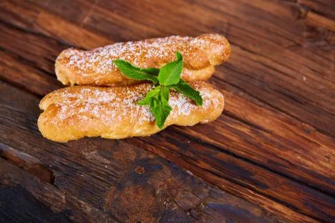 Two eclair decorated with mint Stock-Fotos