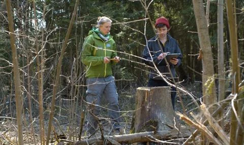 Two eco activists in the forest Stock Photos