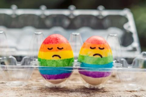 Two eggs are colored in the colors of the rainbow as a flag of gays and lesbi Stock Photos