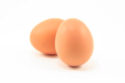 Two eggs are isolated on a white background Stock Photos
