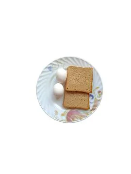 Two eggs with bread on a plate with no background Foto stock