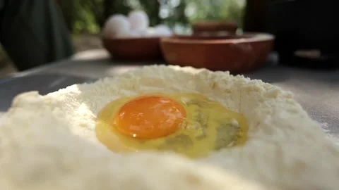 Two Eggs Cracked into Flour for Baking 스톡 동영상 280120942