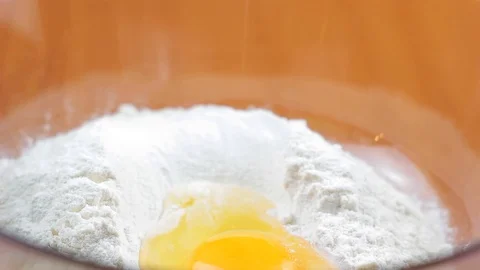 Two eggs fall into the flour Video stock 103417611