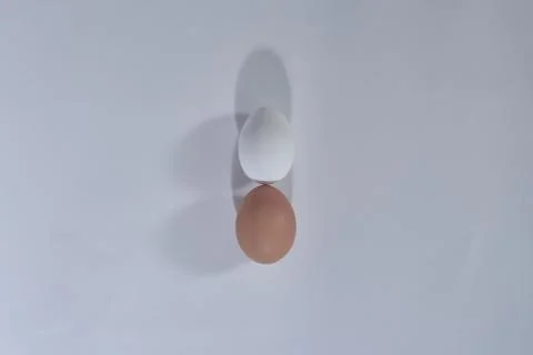 Two eggs grey plain minimal background, top view, happy Easter day 스톡 사진