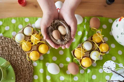 Two eggs for the holiday of easter in the hands of a child 库存照片